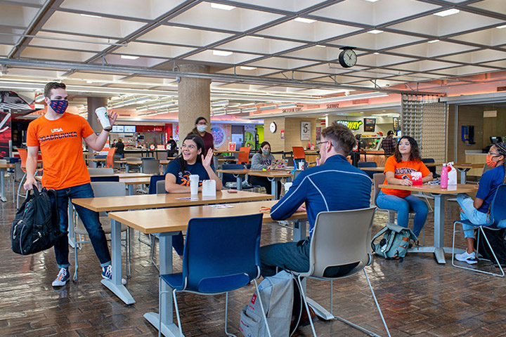 Students sitting in a study room table with their laptops